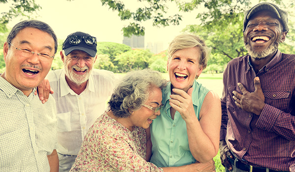 Group of Retired Friends Laughing Outside What Is An Annuity California
