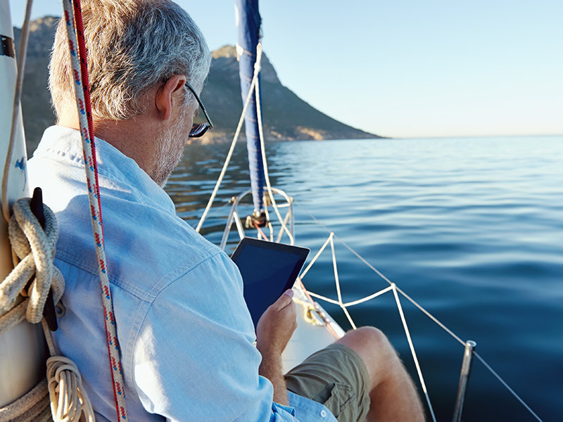 senior man on sail boat using life insurance for retirement income folsom ca
