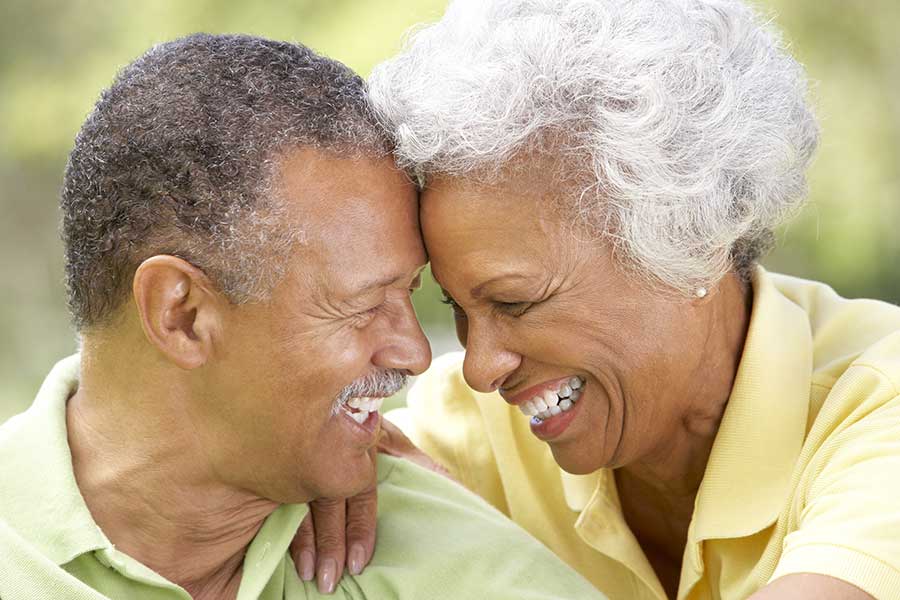 annuity death benefit older black couple laughing